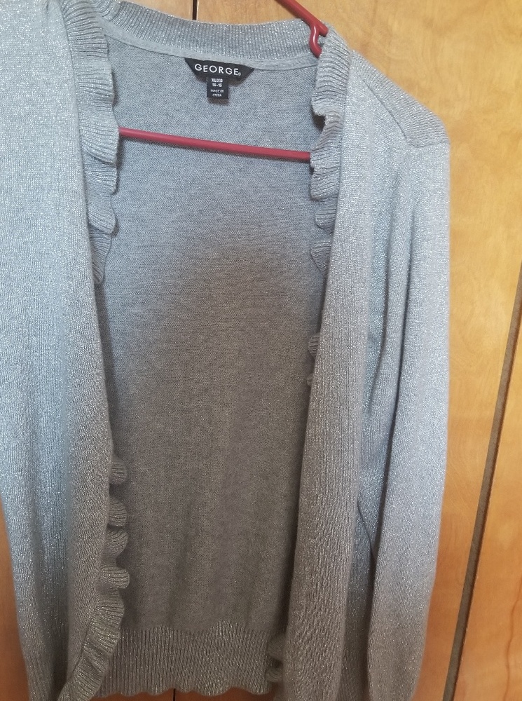 Its sliver with some sparkles on it it's a XL